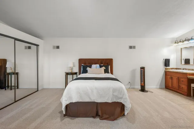 a bedroom with a bed and a table