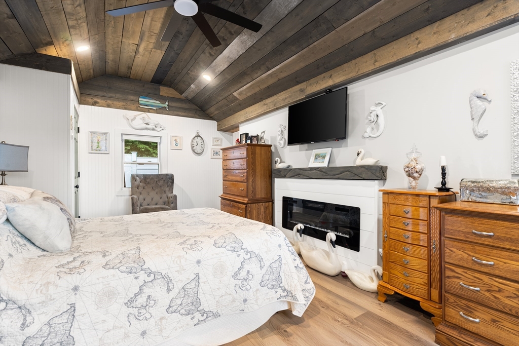 25 Lakeview Drive Wareham, MA 02538 - Photo 18 of 31 a bedroom with a bed and flat screen tv