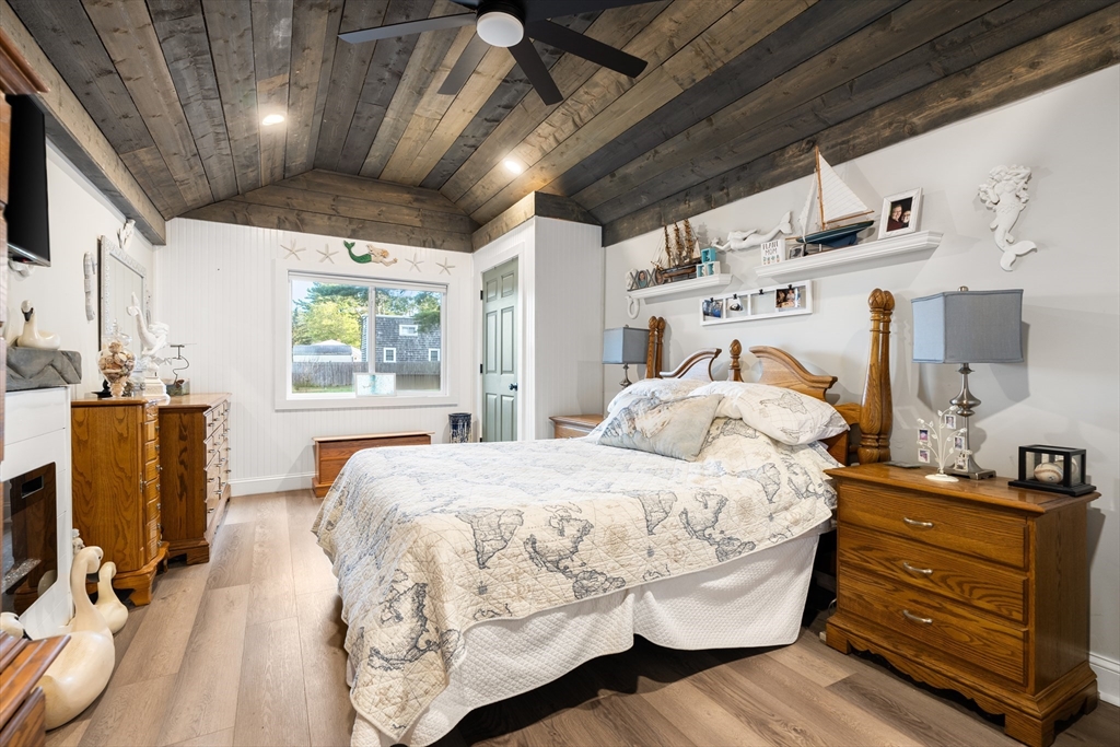 25 Lakeview Drive Wareham, MA 02538 - Photo 19 of 31 a bedroom with a bed and wooden floor