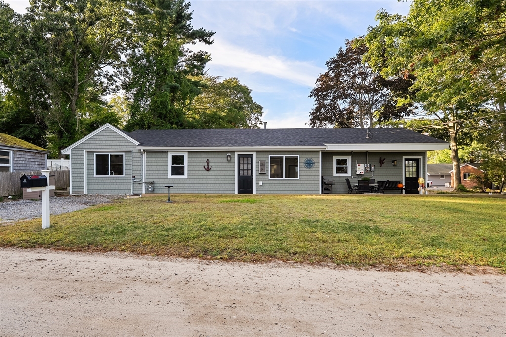 25 Lakeview Drive Wareham, MA 02538 - Photo 2 of 31 a front view of a house with a garden