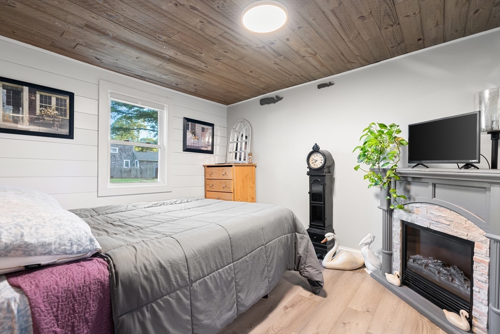 25 Lakeview Drive Wareham, MA 02538 - Photo 21 of 31 a bedroom with a bed and a flat screen tv