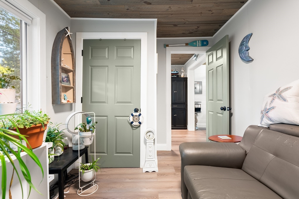 25 Lakeview Drive Wareham, MA 02538 - Photo 25 of 31 a living room with furniture and a potted plant
