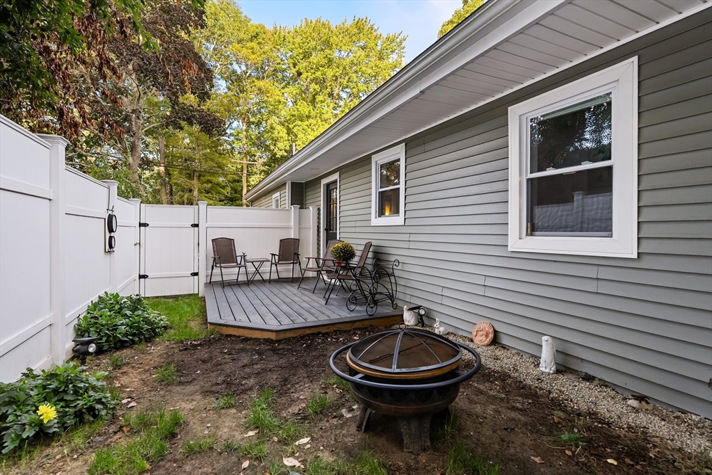 25 Lakeview Drive Wareham, MA 02538 - Photo 30 of 31 a view of back yard of the house with outdoor seating