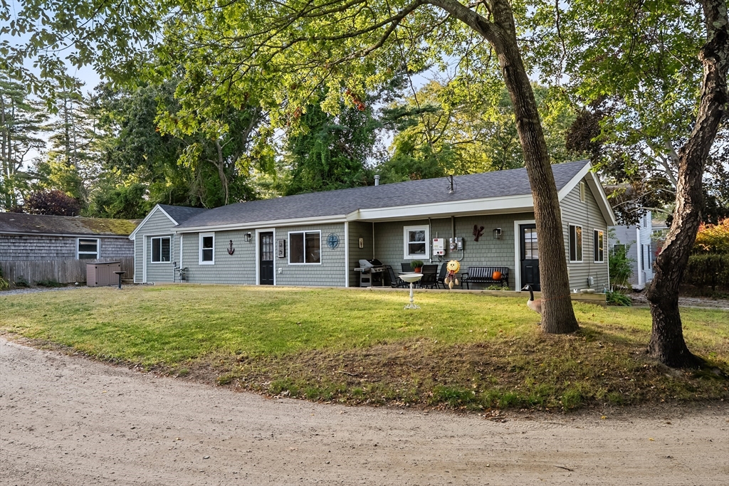 25 Lakeview Drive Wareham, MA 02538 - Photo 3 of 31 a front view of a house with garden