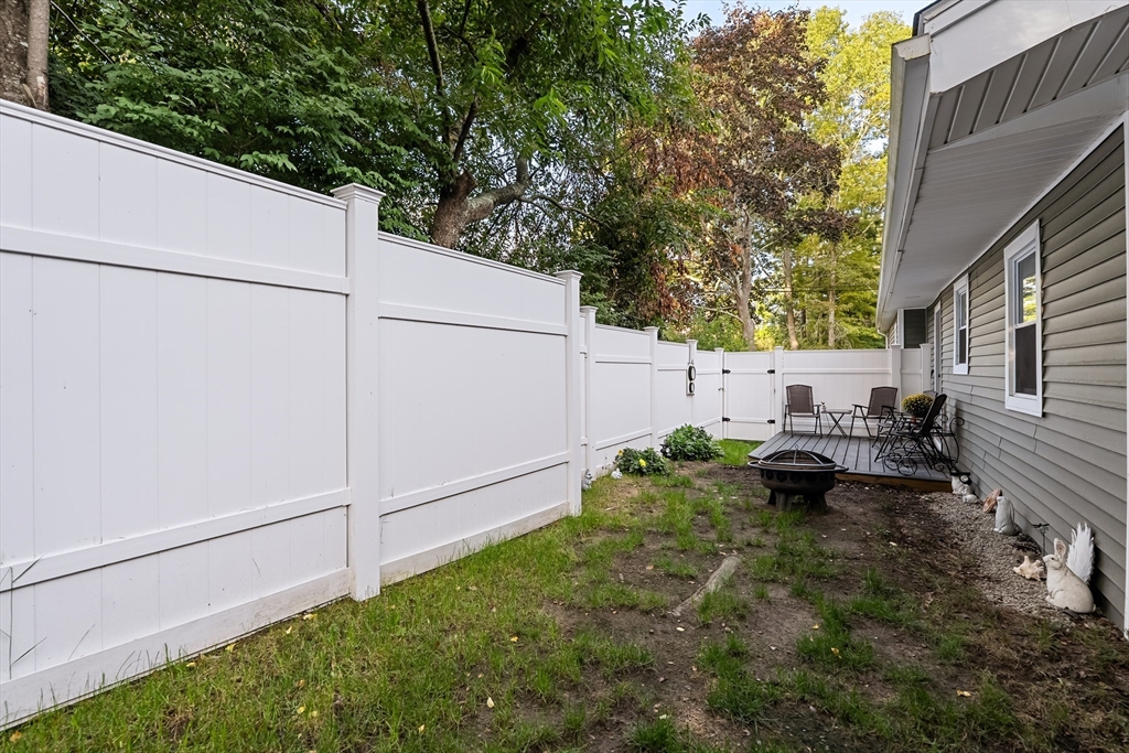 25 Lakeview Drive Wareham, MA 02538 - Photo 31 of 31 a backyard of a house with table and chairs