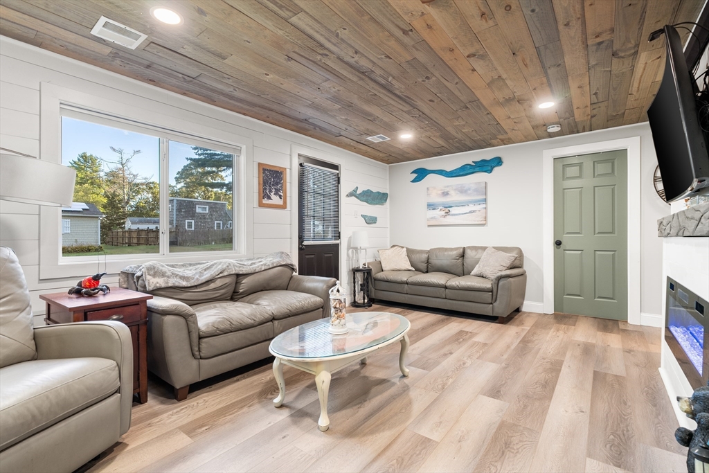 25 Lakeview Drive Wareham, MA 02538 - Photo 8 of 31 a living room with furniture and a fireplace