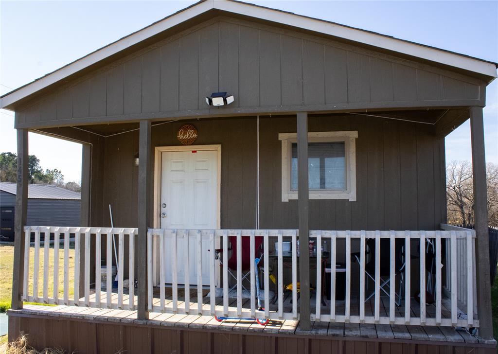 a balcony view with a black gate