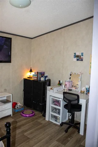 a bedroom with a bed and cabinets