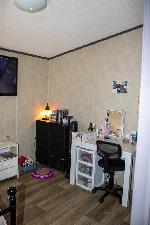 145 Firefly Drive Springtown, TX 76082 - Photo 15 of 16 a bedroom with a bed and cabinets