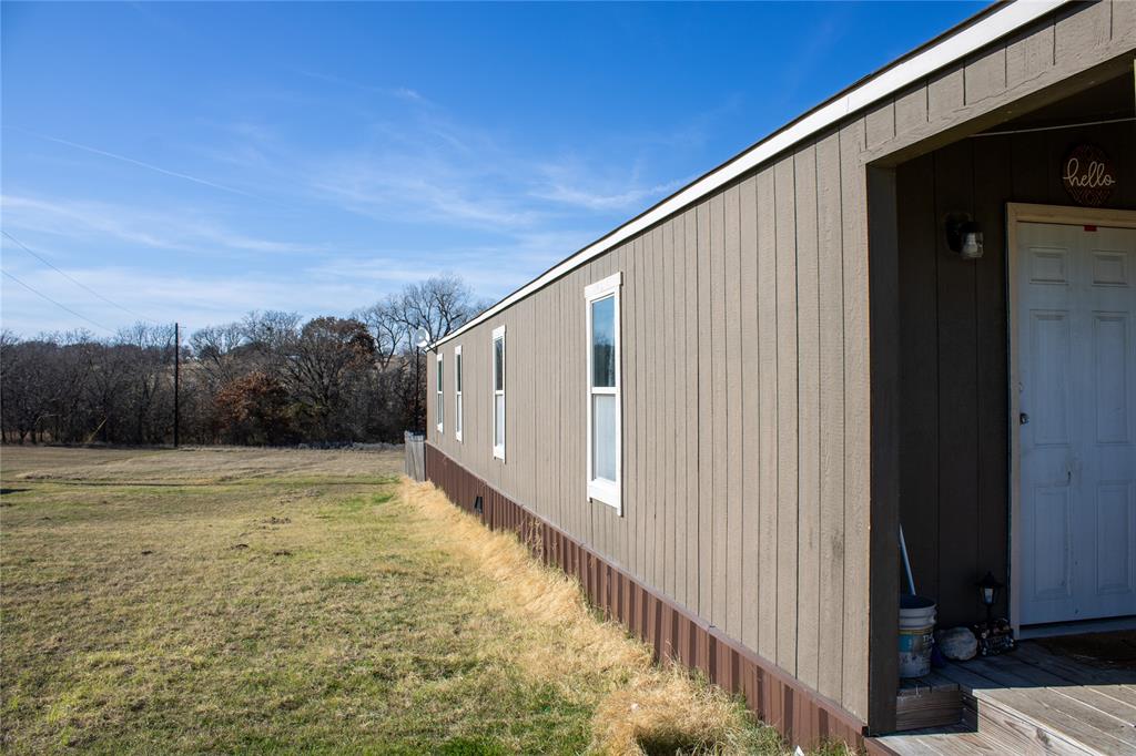145 Firefly Drive Springtown, TX 76082 - Photo 2 of 16 a view of a balcony