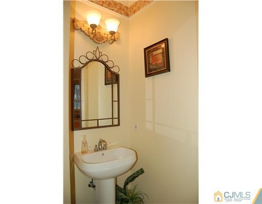 12 Ramsey Road Edison, NJ 08820 - Photo 16 of 25 a bathroom with a sink and a mirror