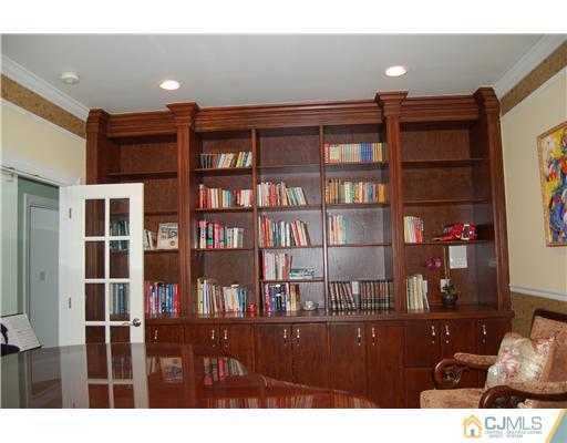 12 Ramsey Road Edison, NJ 08820 - Photo 3 of 25 a room view with a bookshelf