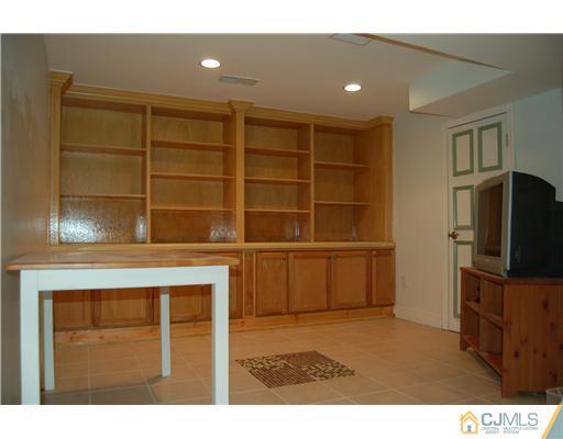 12 Ramsey Road Edison, NJ 08820 - Photo 25 of 25 a living room with a flat screen tv and washer