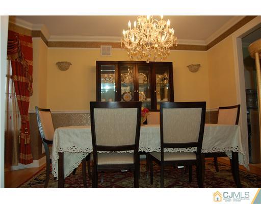 12 Ramsey Road Edison, NJ 08820 - Photo 6 of 25 a view of a dining room with furniture and chandelier