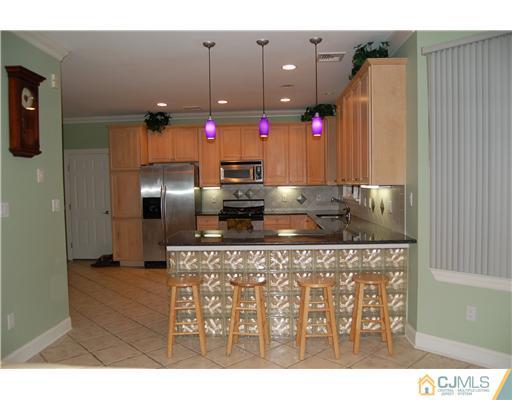 12 Ramsey Road Edison, NJ 08820 - Photo 9 of 25 a kitchen with refrigerator and window