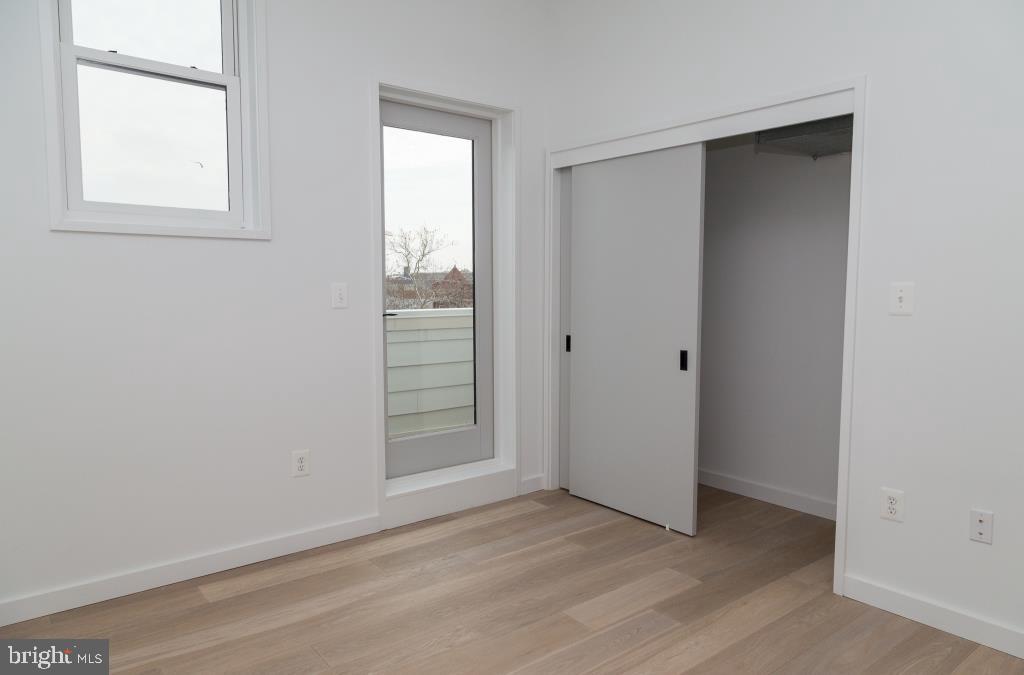 1443 Euclid Street Northwest, Unit 8 Washington, DC 20009 - Photo 12 of 20 an empty room with windows