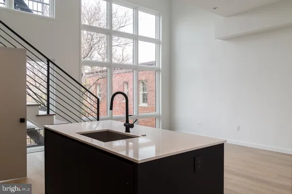 a kitchen with a sink and a window