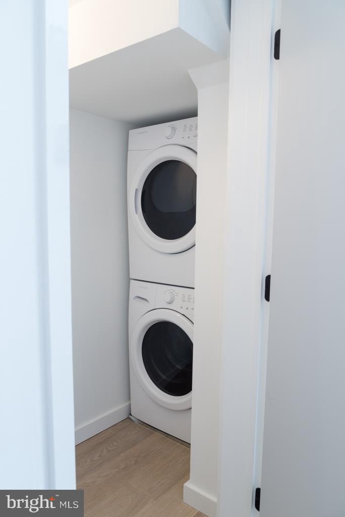 1443 Euclid Street Northwest, Unit 8 Washington, DC 20009 - Photo 8 of 20 a utility room with dryer and washer