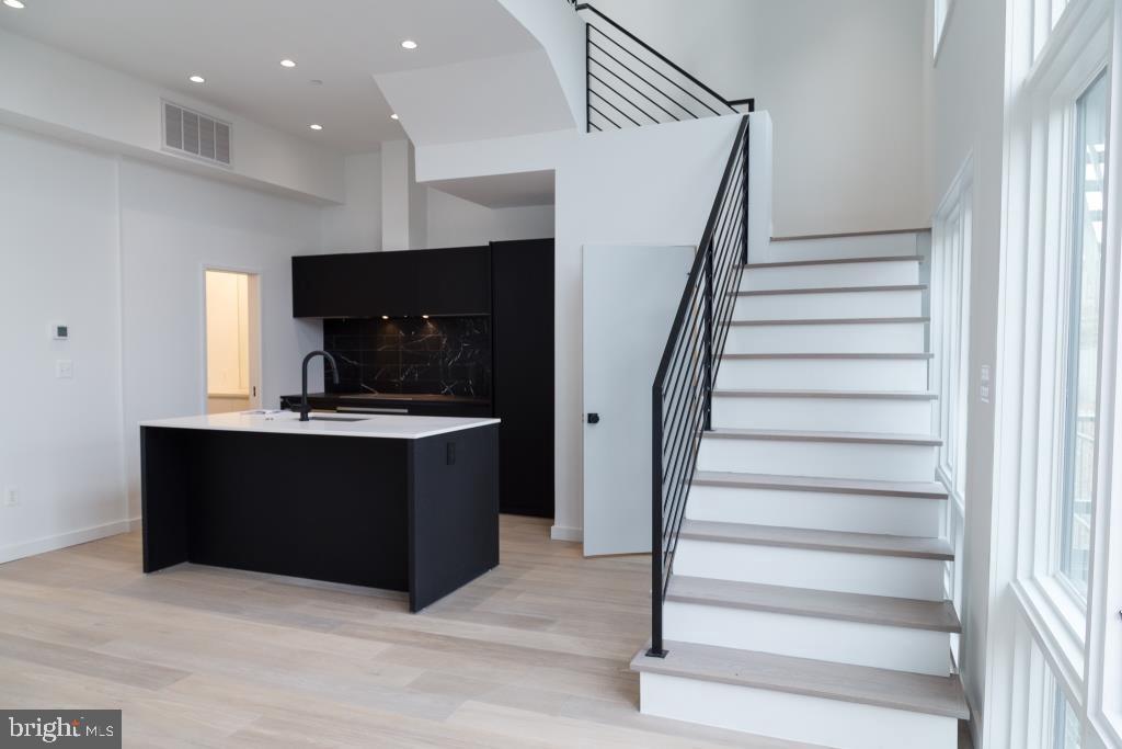 1443 Euclid Street Northwest, Unit 8 Washington, DC 20009 - Photo 10 of 20 a view of kitchen with microwave and cabinets