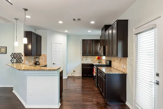 a bathroom with a sink a mirror and a window
