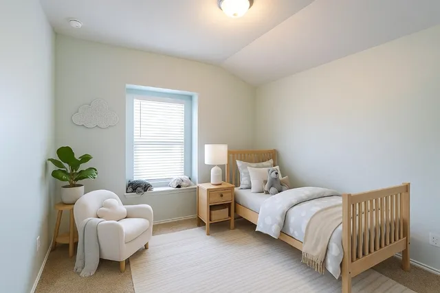 a bedroom with a bed and a couch