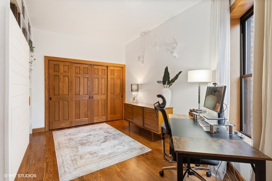 4070 North Sheridan Road, Unit 3 Chicago, IL 60613 - Photo 18 of 21 a view of a workspace with furniture and a window