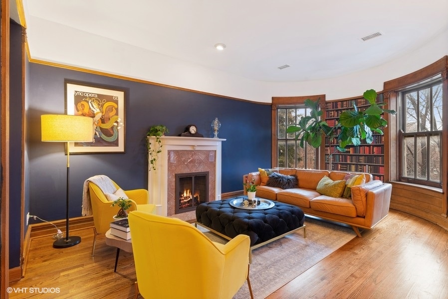 4070 North Sheridan Road, Unit 3 Chicago, IL 60613 - Photo 4 of 21 a living room with furniture and a fireplace