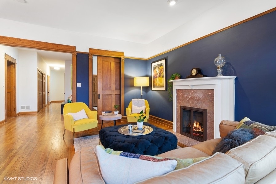 4070 North Sheridan Road, Unit 3 Chicago, IL 60613 - Photo 6 of 21 a living room with furniture and a fireplace