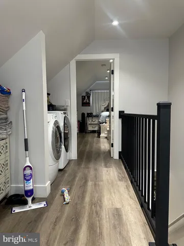 a view of a hallway with washer and dryer