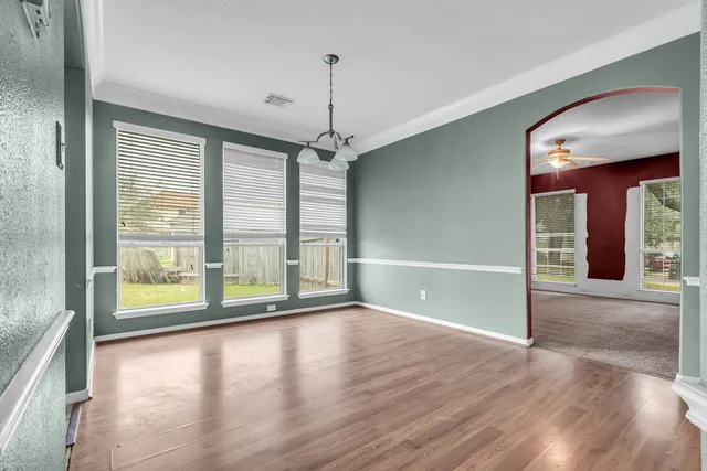 a view of room with window and hardwood floor
