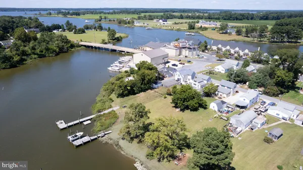 an aerial view of lake and residential houses with outdoor space and river