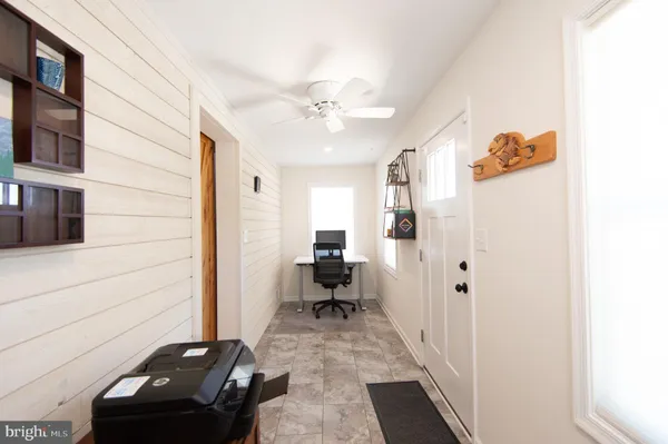 a view of a hallway with workspace