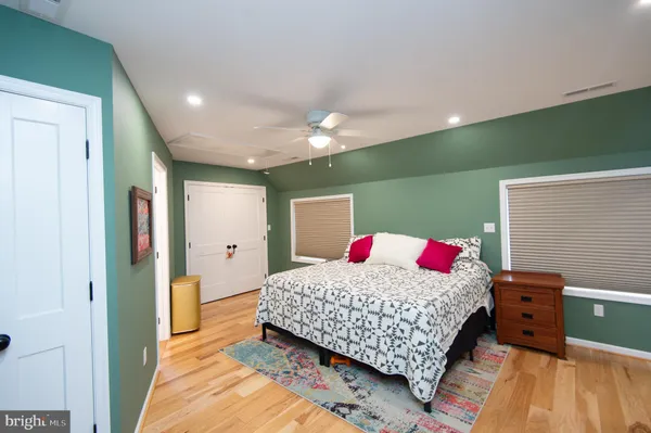 a bedroom with a bed and a dresser