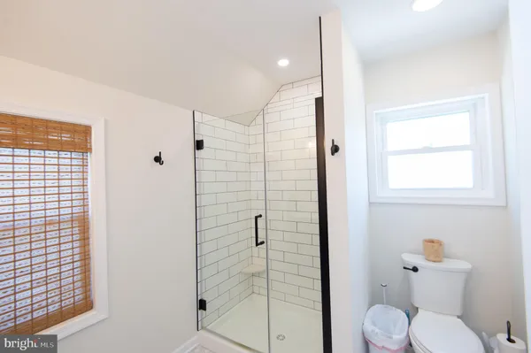 a bathroom with a shower and a sink