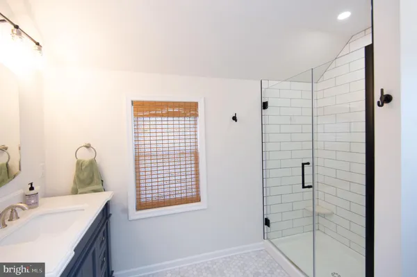 a bathroom with a sink toilet and mirror