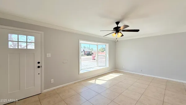 a view of an empty room and window
