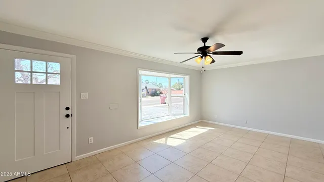 a view of an empty room and window
