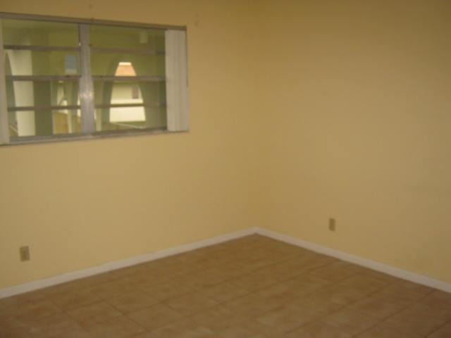 5701 Northwest 2nd Avenue, Unit 313 Boca Raton, FL 33487 - Photo 9 of 11 Master Bedroom