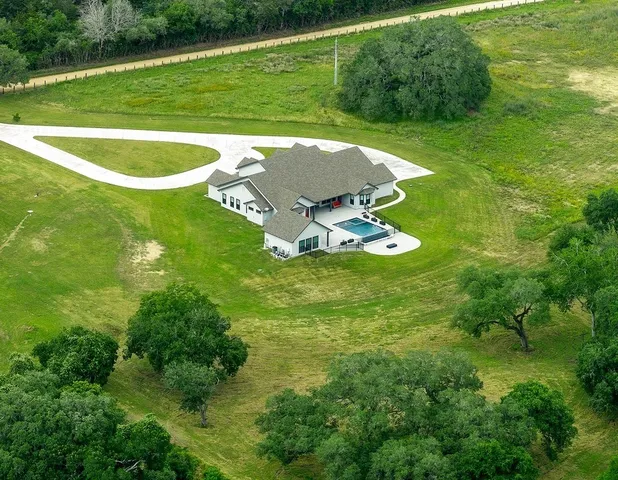 a view of a house with a big yard