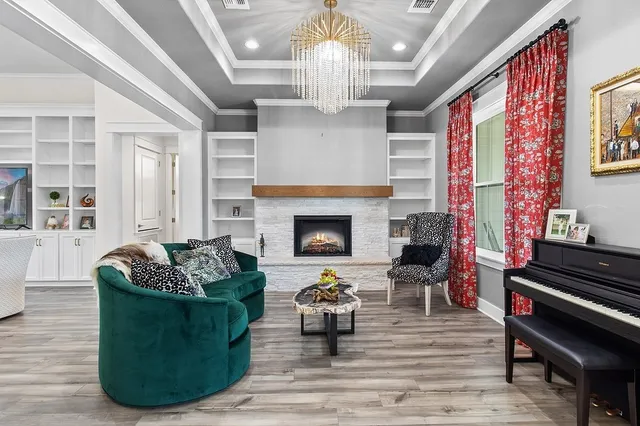 a living room with furniture and a fireplace