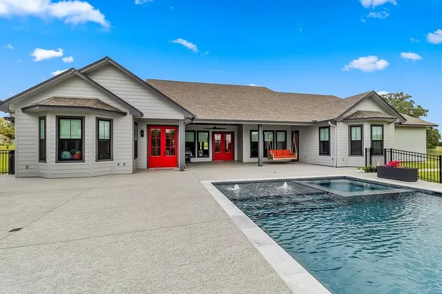 a front view of a house with pool