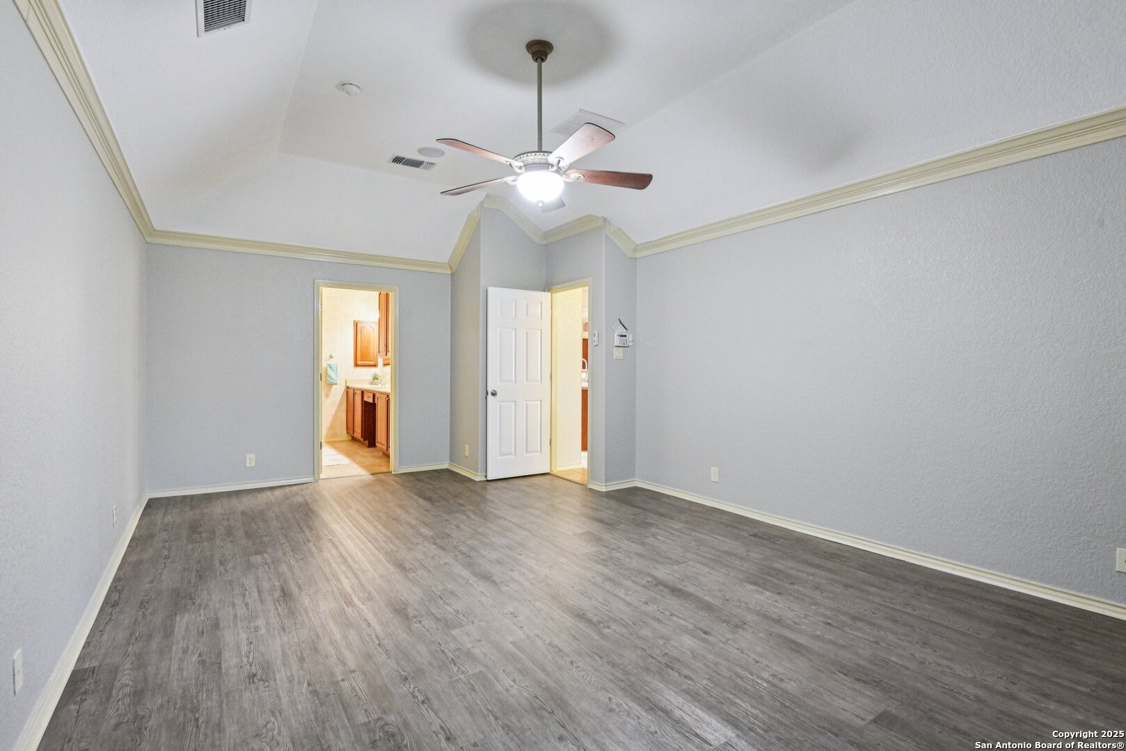 3524 Angora Trail Schertz, TX 78154 - Photo 15 of 25 an empty room with wooden floor chandelier fan and windows