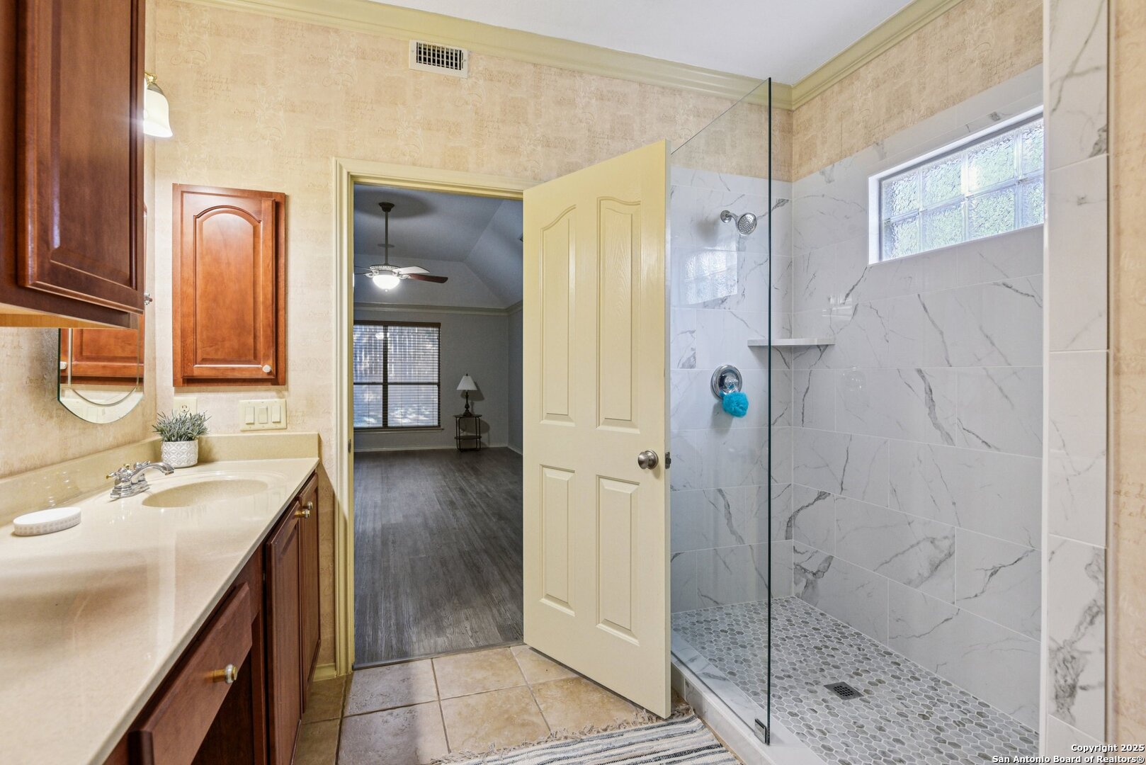3524 Angora Trail Schertz, TX 78154 - Photo 17 of 25 a bathroom with a granite countertop shower sink and mirror