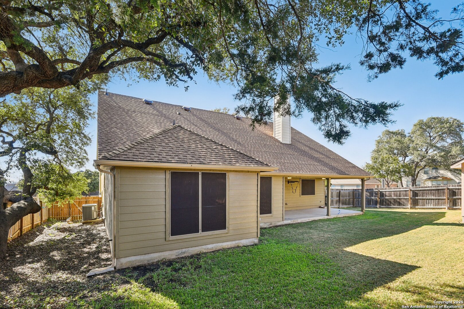 3524 Angora Trail Schertz, TX 78154 - Photo 22 of 25 a view of a yard in front of a house with large tree
