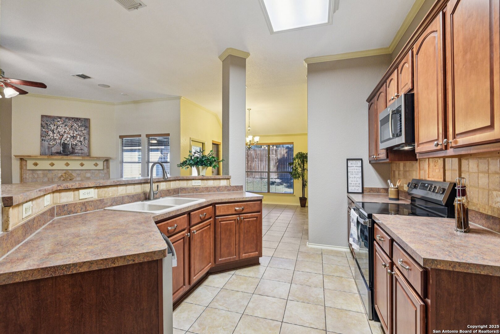 3524 Angora Trail Schertz, TX 78154 - Photo 8 of 25 a kitchen with a sink stove and cabinets