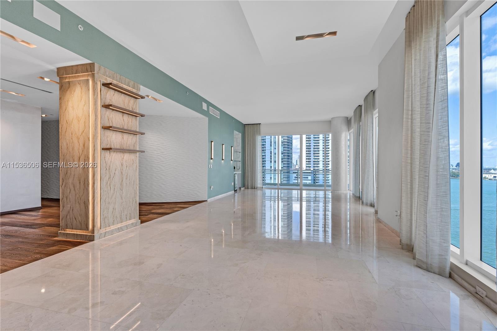 900 Brickell Key Boulevard, Unit 1002 Miami, FL 33131 - Photo 20 of 87 a view of an empty room with a window