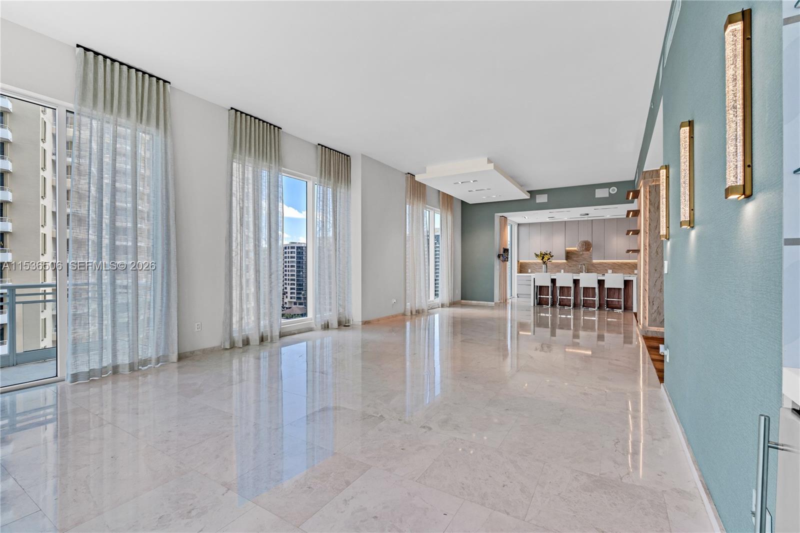 900 Brickell Key Boulevard, Unit 1002 Miami, FL 33131 - Photo 24 of 87 a view of a livingroom with furniture and wooden floor