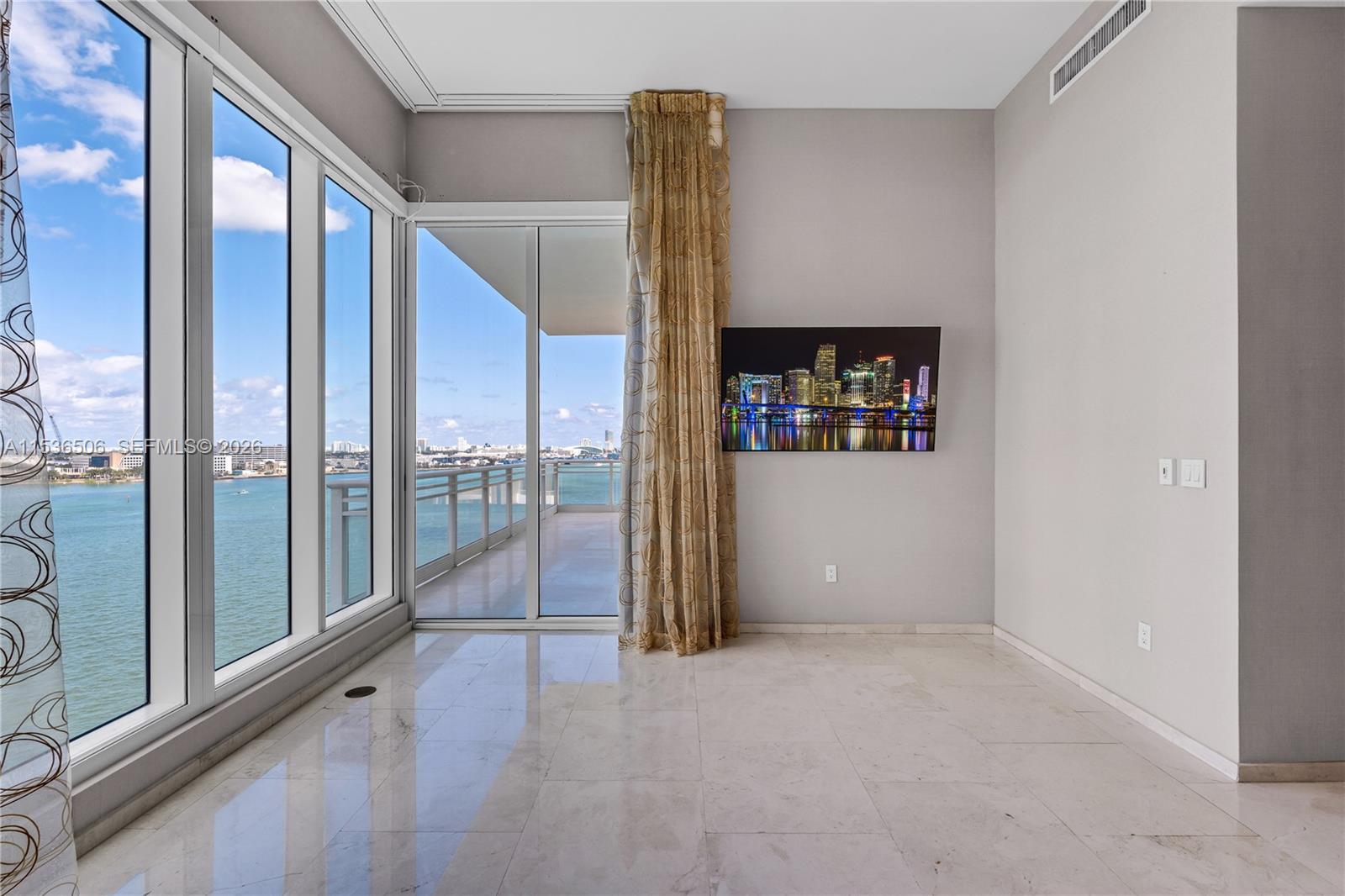 900 Brickell Key Boulevard, Unit 1002 Miami, FL 33131 - Photo 32 of 87 a view of a hallway with windows