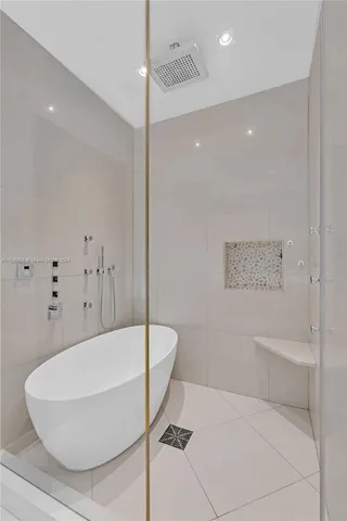 a bathroom with a shower a toilet and a sink
