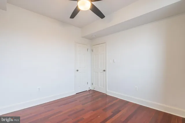 a bathroom with a sink a toilet a shower a vanity and a mirror